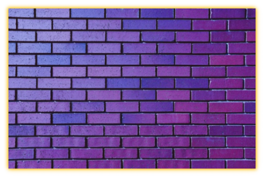 Purple Brick wall representing the Purple Room